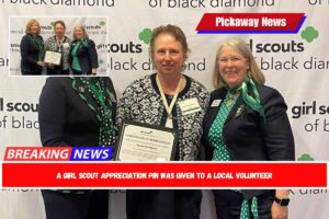 A Girl Scout Appreciation Pin was given to a local volunteer
